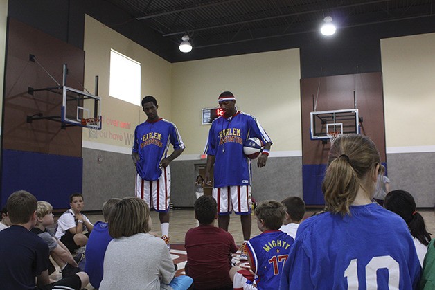Will 'Bull' Bullard and Anthony 'Buckets' Blake (right) speak with a group of campers at the Issaquah 24 Hour Fitness.