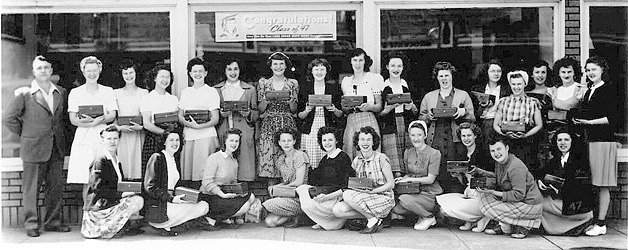 Girls in the Class of 1947 (above) pose with Reginald Thomas