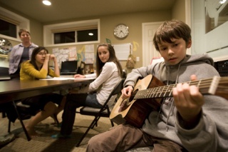 Tom Rothwell practices a guitar piece during a recent class at the Fleming School of Music.