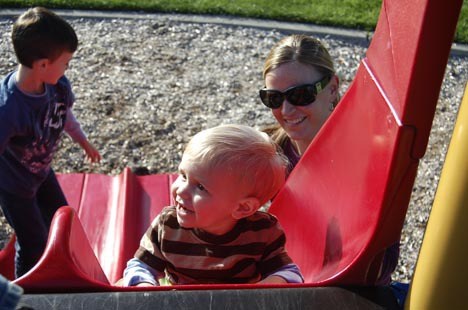 Gavin Bethkey and mom Kelly enjoy the slide at Black Nugget Park in the Issaquah Highlands.