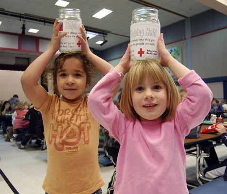 Even the little ones are lending a hand - Kindergarden students Theresa Hard and Elizabeth Posten are hoping their school can raise $500 to send to the American Red Cross to help the recovery effort in Haiti.