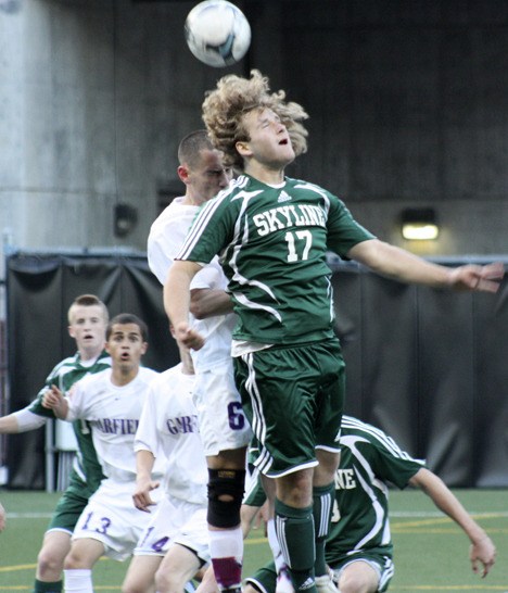 Skyline's Braxton Griffin heads a throw-in from Mitchell Kim in the 7th minute of Tuesday's KingCo Championship with Garfield. The ball went directly to Travis Strawn (far back) who headed it in for a goal.
