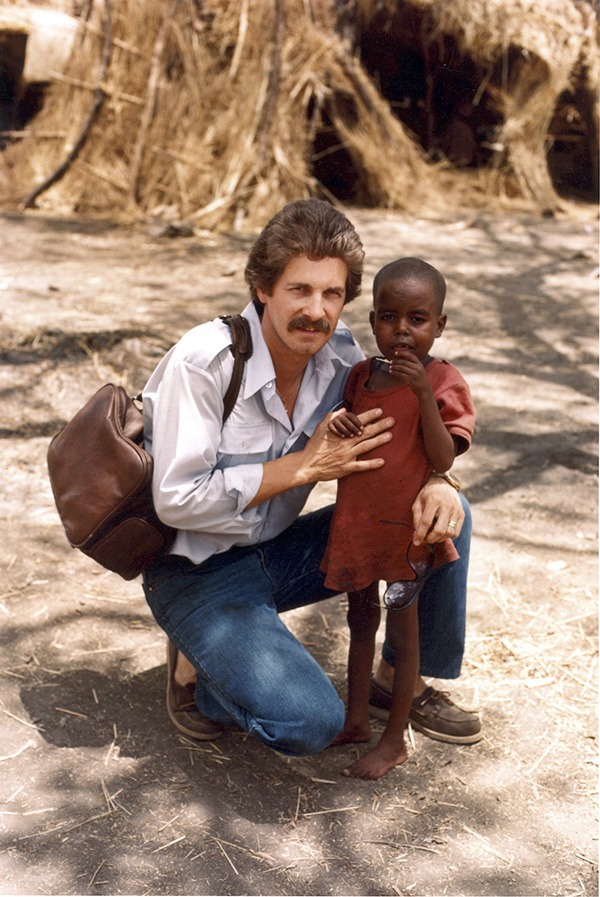 O'Neill with a child in Sudan-1984.