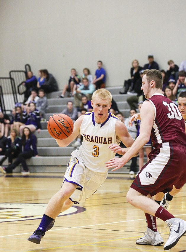 Issaquah Eagles guard Ty Gibson makes a move toward the basket during a game earlier this season.