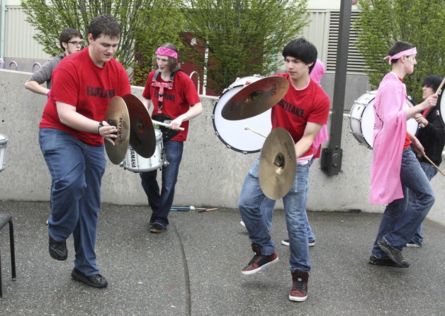 Zach Evans and Matt Wallig from Eastlake High School perform to greet visitors for Plateau Pink Day May 11. The tri-high event