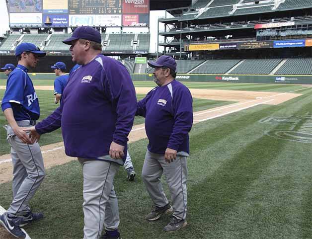 Issaquah baseball coach Rob Reese (front) shakes hands in an undated photo.