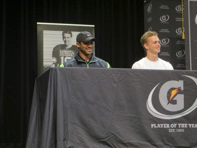 Russell Wilson and Max Browne look on during the ceremony on Tuesday for the National Player of the Year.