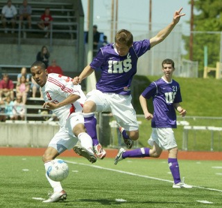 Issaquah's Kelby Lemons battles with Marysville-Pilchuck's John Crenshaw for a loose ball Saturday afternoon