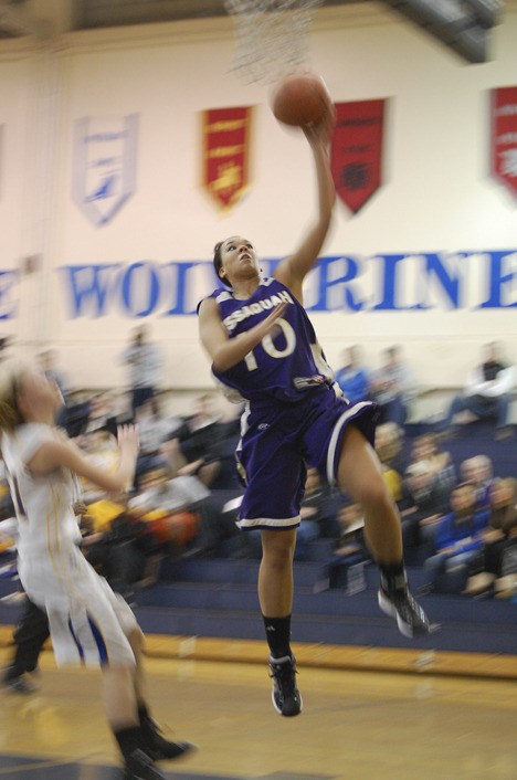 Maddey Pflaumer goes up for two of her team-best 14 points Saturday against Bellevue.