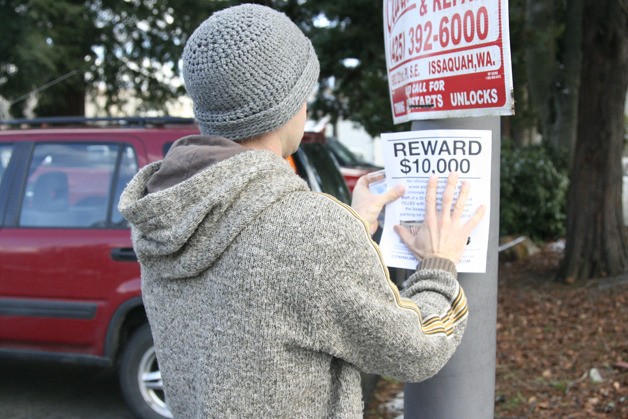 Zack Judson posts reward signs in March for his stolen possessions. Police recovered many of his belongings this November.