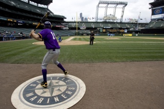 Gavin Shumaker takes a practice swing in the Seattle Mariner’s batting circle Saturday afternoon.
