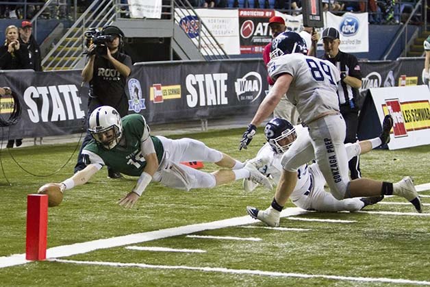 Skyline Spartans senior quarterback Blake Gregory dives for the pylon against the Gonzaga Prep Bullpups in the Class 4A state title game. Gonzaga Prep defeated Skyline 34-16 on Dec. 5 at the Tacoma Dome.
