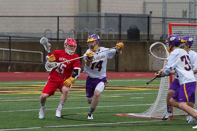 Nate Holbrook (No. 14) plays solid defense against Newport. Holbrook attended the Nike Blue Chip Lacrosse Camp in Baltimore earlier this summer.
