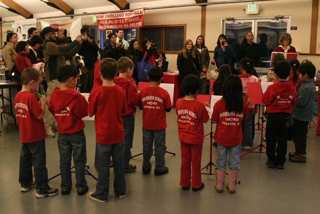Students from the SnoSprings School play their recorders at the Education Expo Tuesday night. Parents made up most of the crowd near the booths
