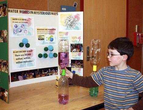 Sunny Hills Elementary student Will Arnold gets ready to let chemistry do its thing as he demonstrates his project at the school's Science Fair on Thursday.