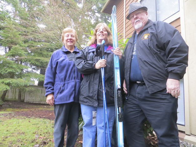Michelle Jay (center) stands with her parents Elaine and Raymond at her Sammamish home.