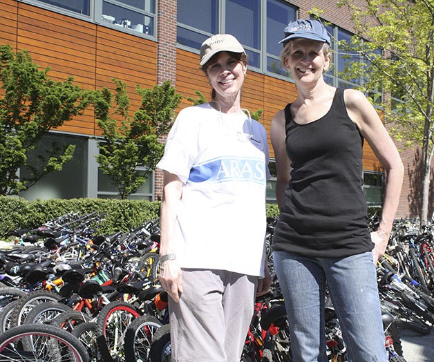 Mary Trask (left) and Meg Watson have been working together on the bike drive in Sammamish since it started.