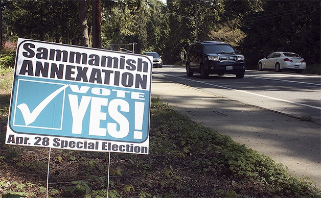 Signs along Southeast Issaquah-Fall City Road near Pacific Cascade Middle School urge residents to vote “yes” for the Klahanie annexation on the April 28 ballot.