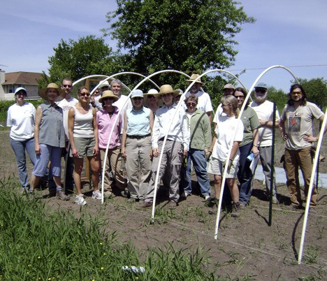 Students pause for a break during last summer’s Beginning Hoophouse Construction at 21 Acres.