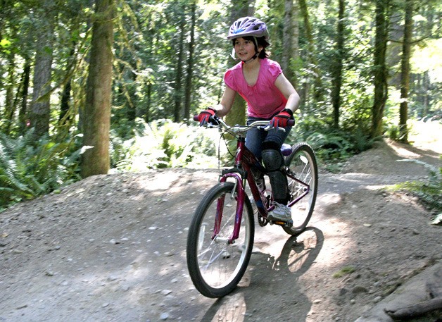 Katie Sinfield rides down the Luna Line at Duthie Hill Park as a part of girls dirt camp. Some say the region could use more parks like these.