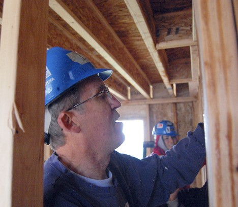 Dick Gram of the Faith United Methodist Church in Issaquah is one of the many volunteers from local church group whose volunteer labor and fundraising efforts has helped Habitat for Humanity provide affordable housing for families over the past decade.