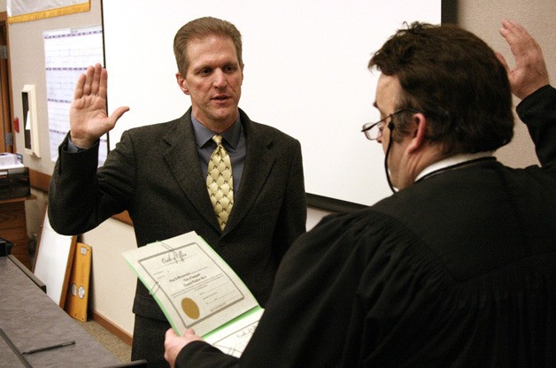 Issaquah City Councilmember Paul Winterstein was sworn in Tuesday by judge Scott Stewart.