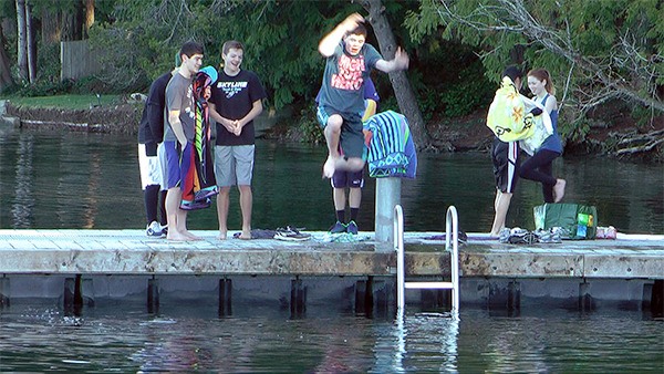 Skyline High School sophomore Eric Candaux jumps into Pine Lake Friday to welcome in the new year. Friends