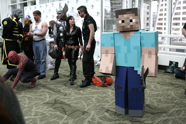 Nerds showoff their costumes at Emerald City Comicon. Above is 8-bit man.