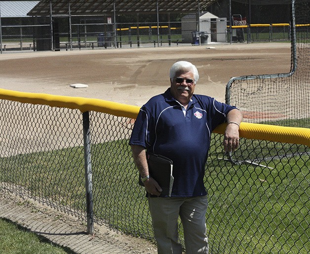 Bob Toigo stands near a baseball diamond at East Sammamish Park