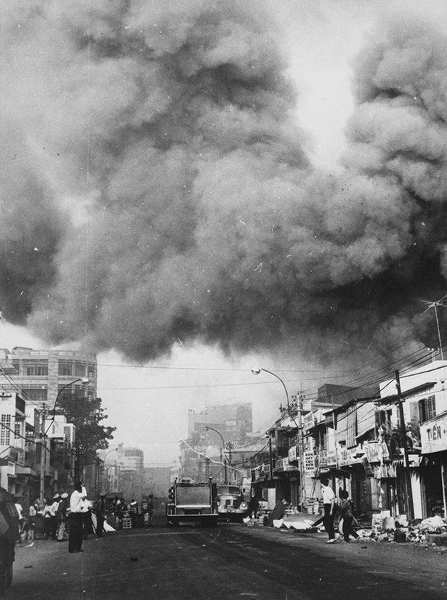 Black smoke rises ove rthe South Vietnamese capital of Saigon