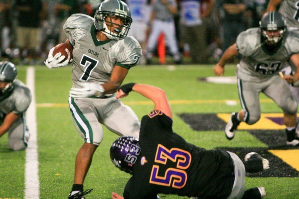 Skyline's Damien Greene evades Issaquah's Trevor Alexander Friday night.