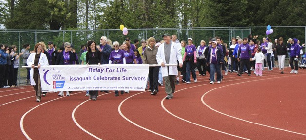 Overlake Hospital doctors lead the ceremonial survivor’s lap at the beginning of Relay for Life at Skyline High School last Saturday.