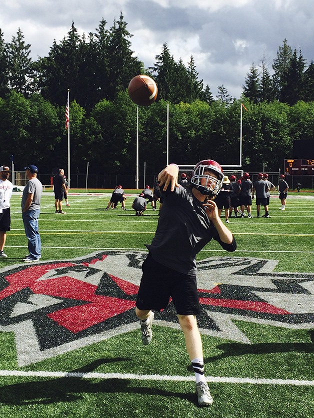 Eastlake Wolves reserve quarterback Connor Brown unleashes a pass to an open wide receiver during the third day of spring football practice on June 2 at Eastlake High School in Sammamish.