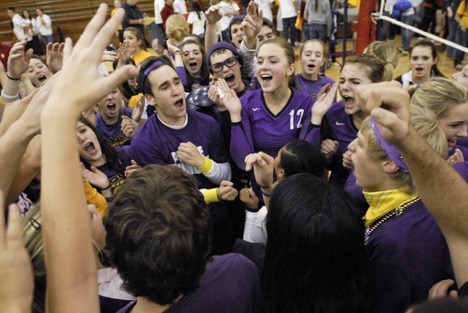 The Issaquah volleyball team and fans celebrate winning the regular-season KingCo 4A title. The Eagles finished the season 20-1