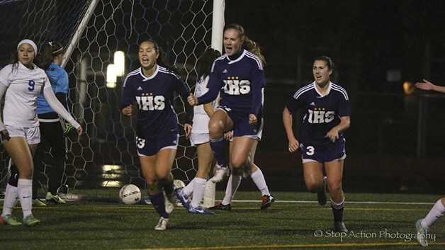 Issaquah players celebrate after Claudia Longo scored the go-ahead goal on a corner kick in the 66th minute of play. The Eagles defeated the Curtis Vikings 3-2
