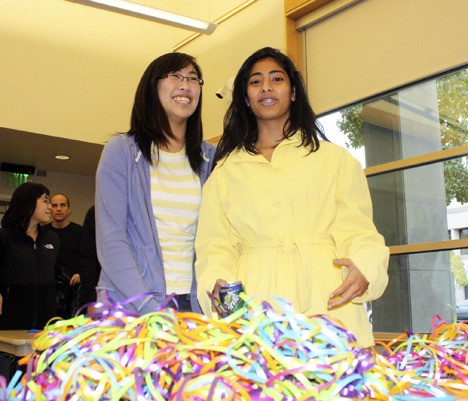Skyline sophomores Kathy Lee and Nicole Advani were part of the Key Club contingent who helped brighten Christmas for low-income families in the area at the Cheerful Givers event in Redmond recently