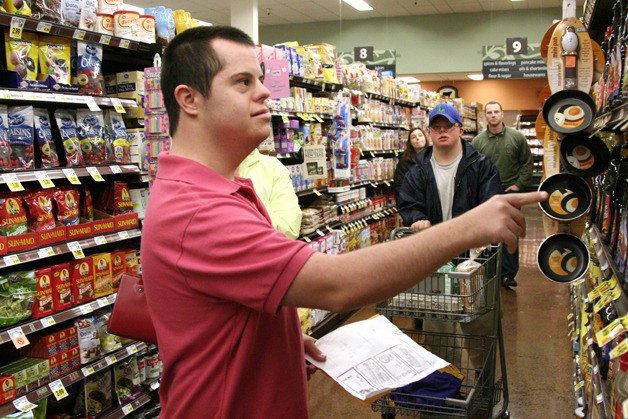 Stephan Daghofer finds the maple syrup at a grocery store in Issaquah. The ACT program