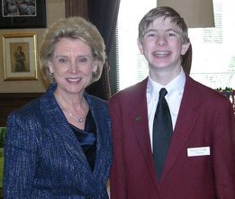 Gov. Chris Gregoire poses with Senate Page Cole Paxton of Bellevue.