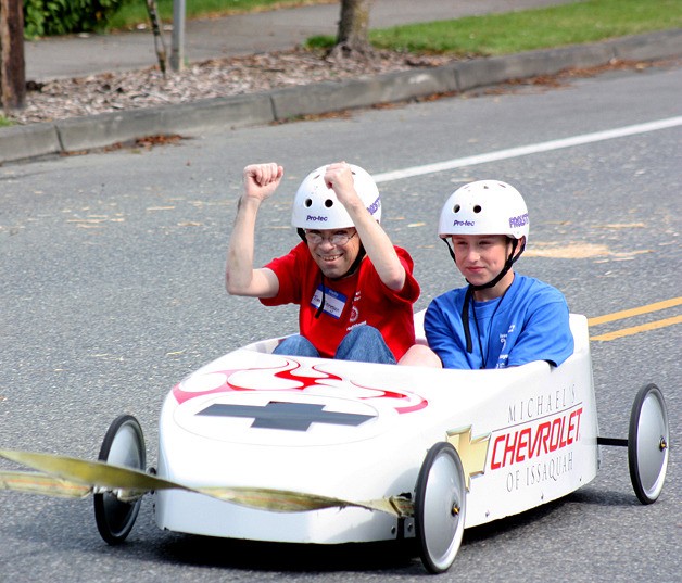 Tim Finnegan celebrates a win at the 15th Challenge Day soapbox derby in Issaquah.