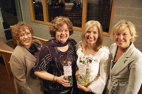 Katherine Crandell of Overlake Hospital presented two trophies to the first-ever joint winners of the Spirit of Sammamish Award
