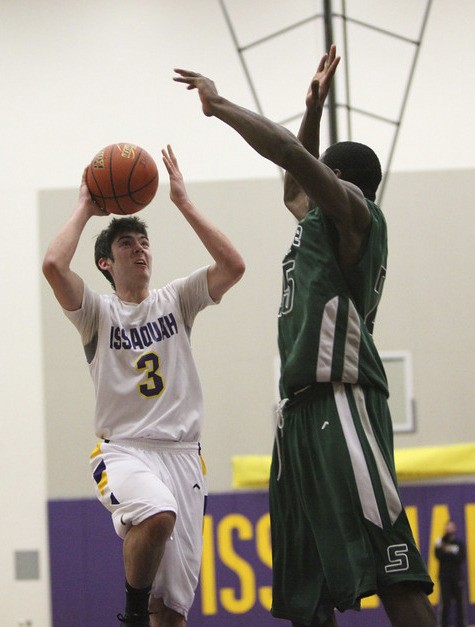 Issaquah's Nick Price hoists a shot up over Skyline's Kasen Williams last season. Price is poised to be one of the league's top scorers in 2012.