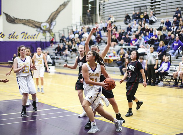Issaquah sophomore Mariah VanHalm drives to the basket against the Eastlake Wolves in a rivalry matchup on Jan. 22. VanHalm scored a team-high 19 points in the 64-53 win against Eastlake.