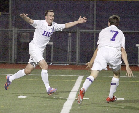 Issaquah's Michael Axelson celebrates with teammate Alex Shane (7) after scoring the winning goal against Ballard Tuesday night in the 79th and final minute.