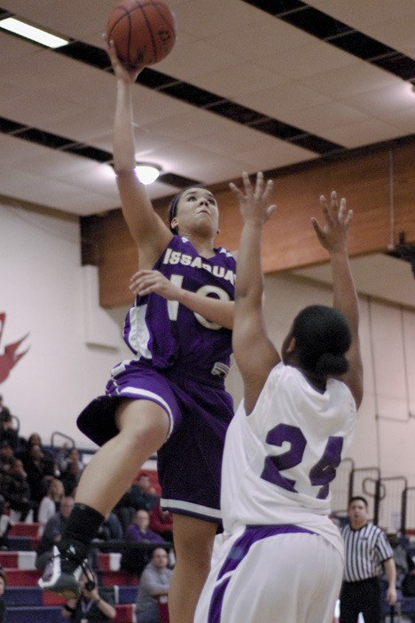 Issaquah's Maddey Pflaumer scores two of her team-high 17 points Tuesday night over Garfield's Alicia Williams.