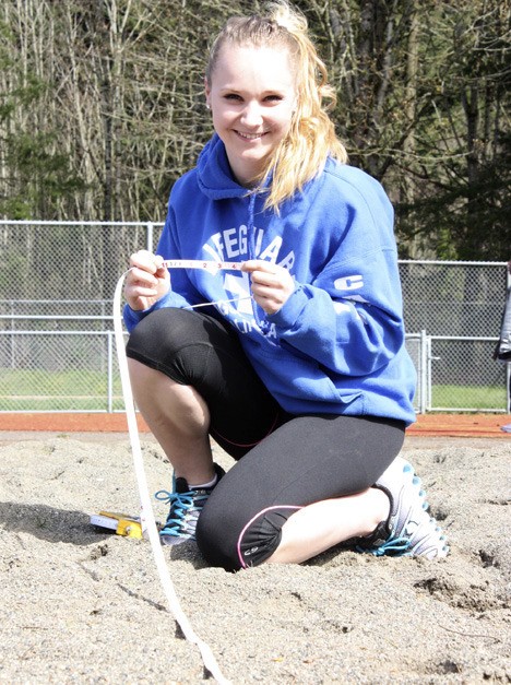 Issaquah’s McKenna Hogan is under an inch away from breaking a 36-year-old school record in the long jump.