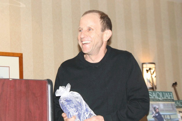 Russ Levy smiles as Kiwanis President David Bleiweiss honors him as the Kiwanis Volunteer of the Year.