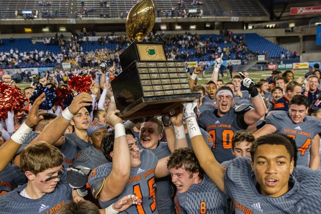 The Eastside Catholic Crusaders football team celebrates its first ever state championship on Dec. 5 at the Tacoma Dome.