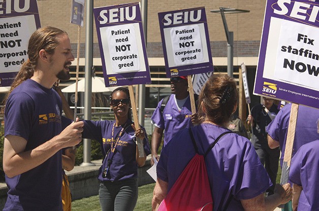 Unionized health care workers picketed outside Swedish Issaquah Wednesday.