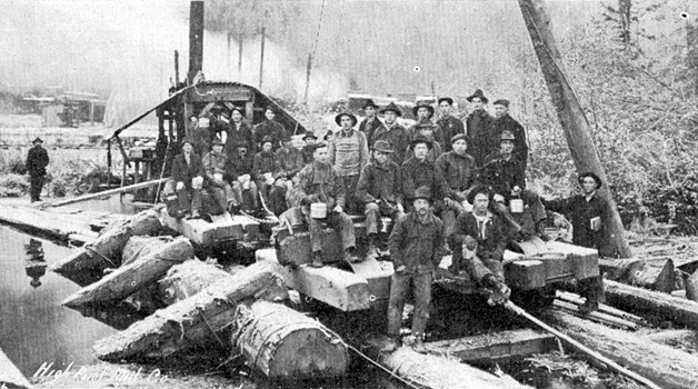 A 'Wooden Pacific' tramcar at the High Point mill pond. The logs have been dumped into the pond