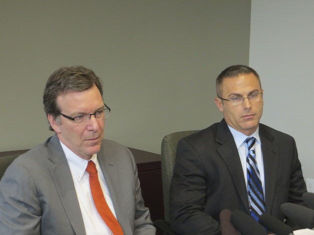 Mark Zmuda is shown here on the right with his attorney